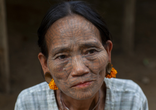 Tribal chin woman with spiderweb tattoo on the face, Rakhine state, Mrauk U, Myanmar