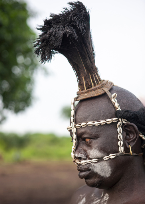 Bodi man with headdress of feathers and cauris for Kael, Omo Valley, Hana Mursi, Ethiopia