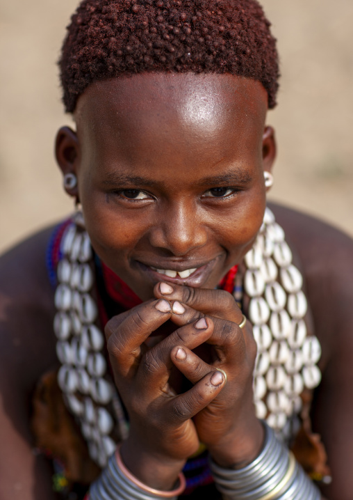 Portrait of Hamer woman wearing necklaces with cauris, Omo valley, Turmi, Ethiopia