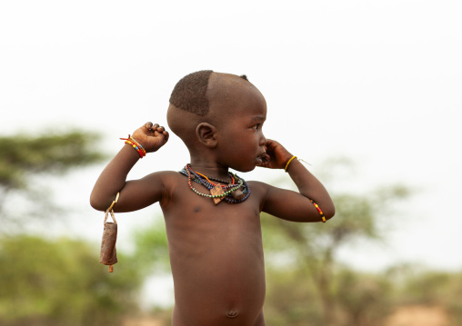 Karo boy with partially shaved head, Omo valley, Korcho, Ethiopia