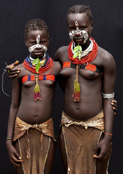 Karo teenage girls with painted faces, Omo valley, Korcho, Ethiopia