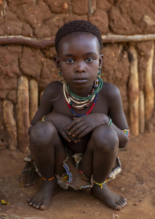 Litte Hamer girl tribe in traditional outfit, Turmi, Omo valley, Ethiopia