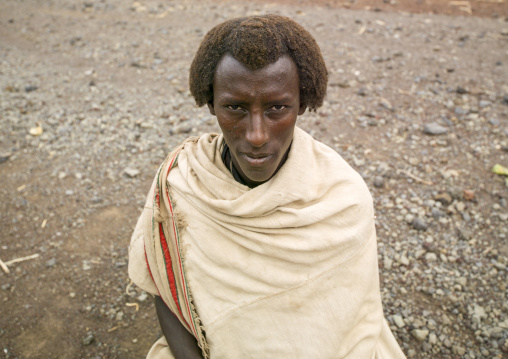 Portrait of a Karrayyu man with traditional hairstyle, Oromia, Metahara, Ethiopia
