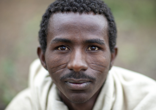 Portrait of a Karrayyu man with scarifications on the face, Oromia, Metahara, Ethiopia