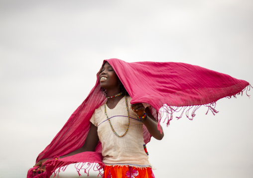 Portrait of a Karrayyu teenage girl with pink shawl, Oromia, Metahara, Ethiopia