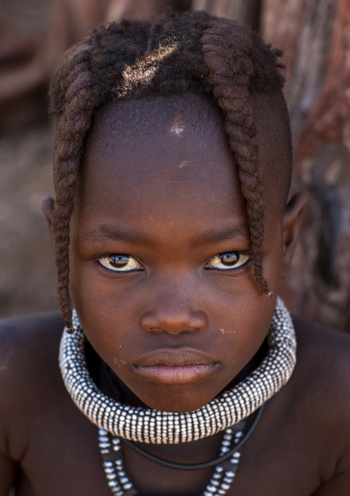 Young Himba tribe girl with traditional hairstyle, Kunene region, Epupa, Namibia