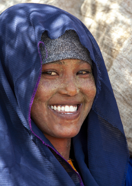 Smiling young woman with quasil on her face, Maroodi Jeh region, Hargeisa, Somaliland