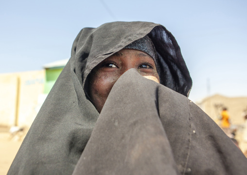 Portrait of a smiling woman with quasil on her face, Maroodi Jeh region, Hargeisa, Somaliland