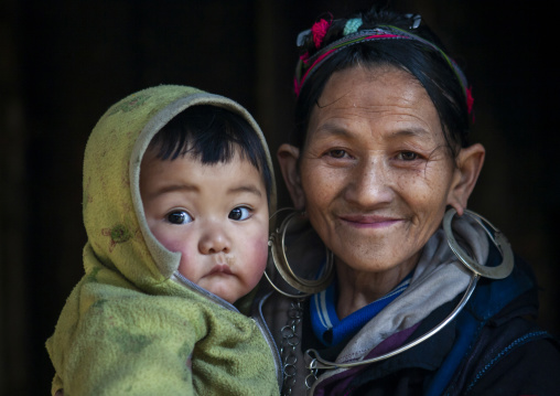 Black Hmong mother and baby in traditional clothes, Lao Cai province, Sapa, Vietnam