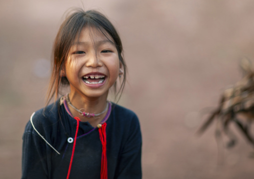 Lantaen minority girl laughing, Luang Namtha, Nam Deng, Laos