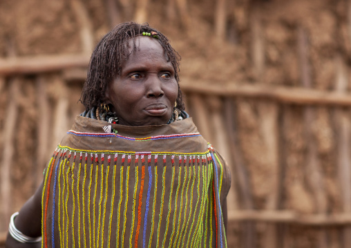 Portrait of a topossa woman, With traditional clothes, Omo valley, Kangate, Ethiopia