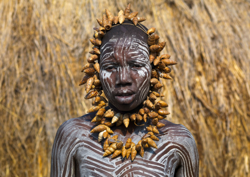 Mursi tribe woman with body painted and shells necklace, Omo valley, Mago, Ethiopia