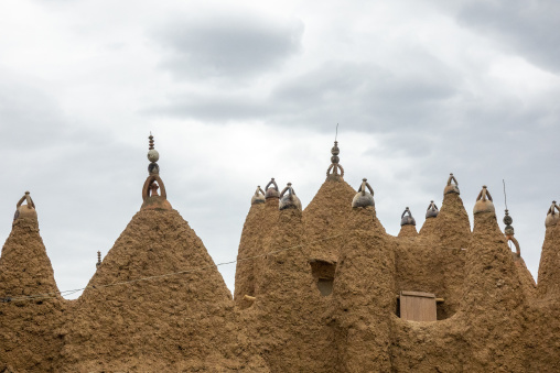 Rows of pointed mud minarets crowned with ceramic finials rise above the 17th-century Sudano-Sahelian mosque, Savanes district, Kouto, Ivory Coast