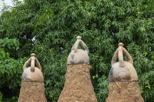 A star and crescent finial crowns the tallest spire beside smaller domed pinnacles at the 17th-century Sudano-Sahelian mosque, Savanes district, Kouto, Ivory Coast