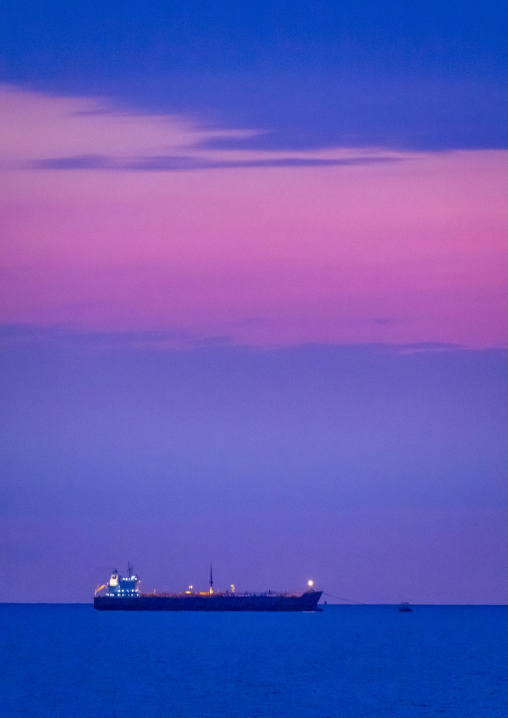 Cargo ship anchored at dusk near Farasan Islands, Jazan Province