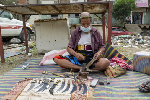Man selling knives in a market, Jazan province, Addayer, Saudi Arabia