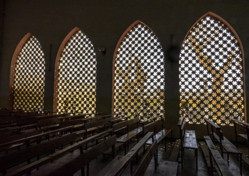 Interior view of a church nave with pierced arched windows and wooden pews, Benguela Province, Benguela, Angola