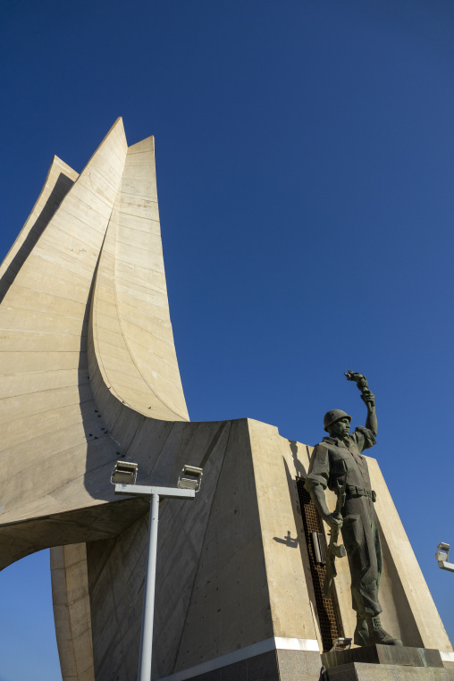 Concrete blades and bronze soldier statue of the Martyrs' Memorial monument, North Africa, Algiers, Algeria