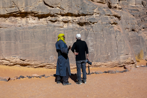 Rock carvings depicting cows, Tassili N'Ajjer National Park, Tadrart Rouge, Algeria
