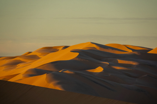 Layered sand dunes at dusk, North Africa, Erg Admer, Algeria