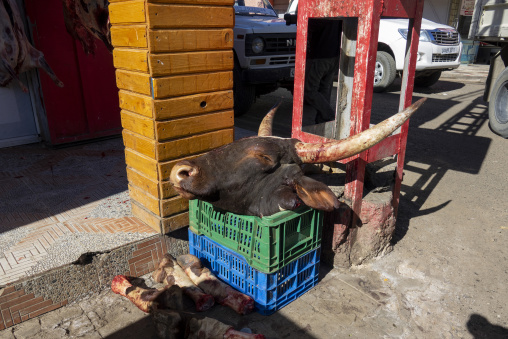 Butcher shop displaying a bull's head and horns on the street, North Africa, Djanet, Algeria