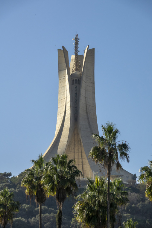 Maqam Echahid martyrs' memorial monument seen through palm trees, North Africa, Algiers, Algeria