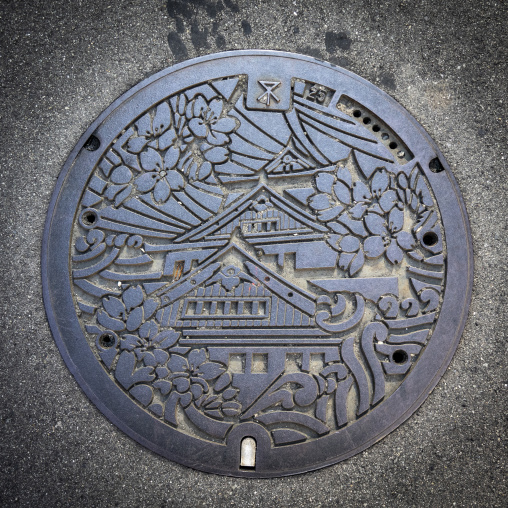 Decorative manhole cover featuring Osaka Castle in Kansai region