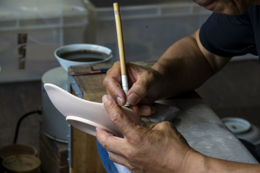 Artisan in Genemongama porcelain atelier, Kyushu region, Arita, Japan