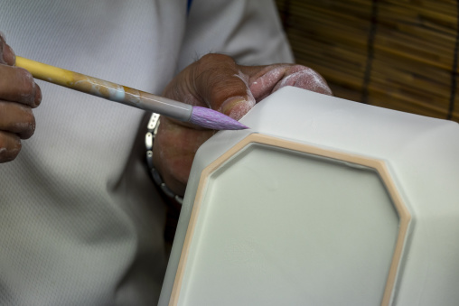 Artisan in Genemongama porcelain atelier, Kyushu region, Arita, Japan