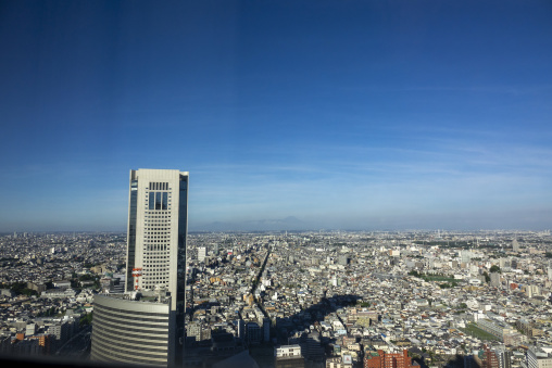 Aerial view of the Tokyo skyline with Mount Fuji visible on the