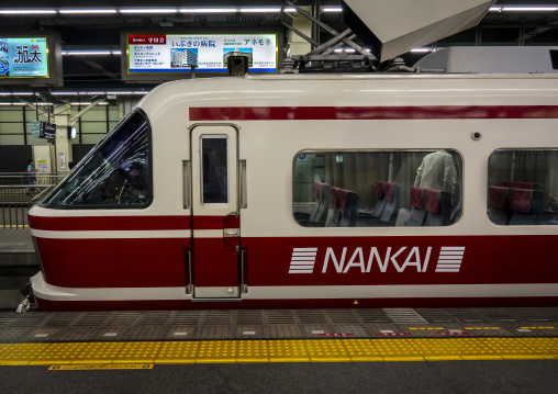 Nankai railway train stopped at a station platform, Hypgo Prefec