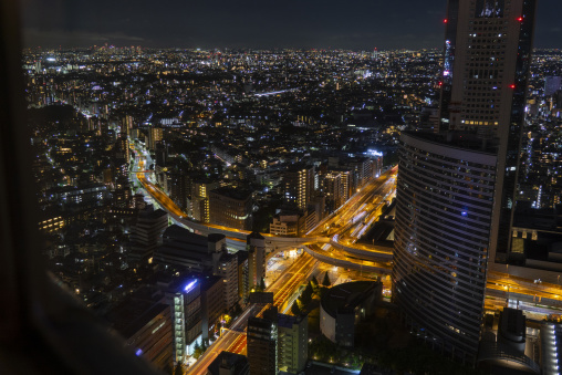 Aerial night view of Tokyo city lights and an elevated expresswa