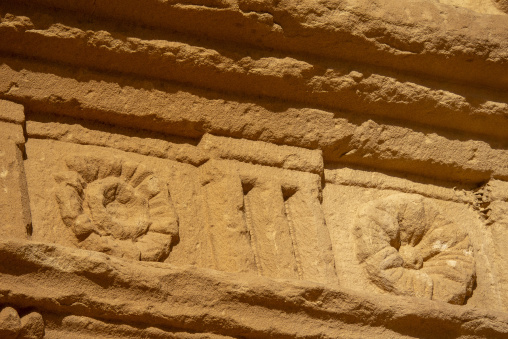 Rosette carving on a Nabataean tomb facade at Hegra, Al Madinah