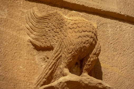 Eagle sculpture and inscription on a Nabataean tomb facade at He