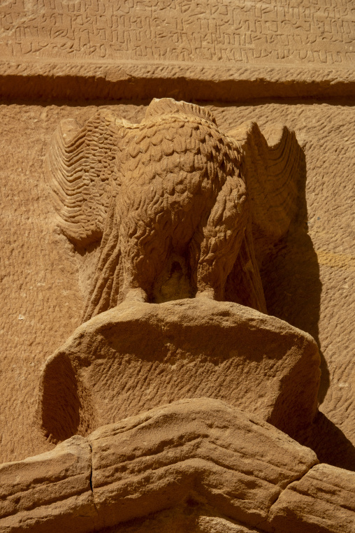 Eagle sculpture carved on a Nabataean tomb pediment at Hegra, Al