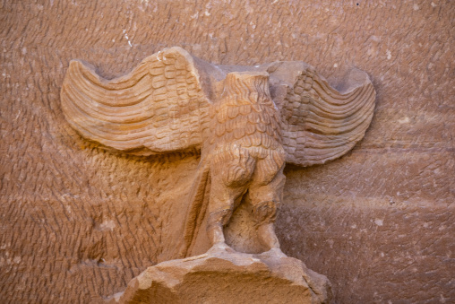Eagle sculpture with spread wings on a Nabataean tomb at Hegra,