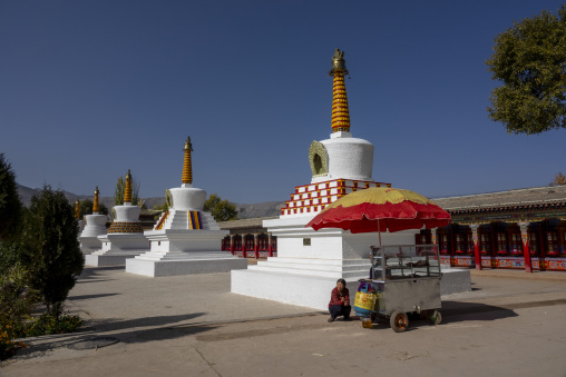 Row of white stupas at Wutun si monastery, Qinghai Province, Wutun, China