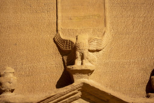 Eagle sculpture beneath an inscription panel on a Nabataean tomb