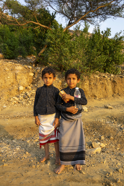 Two boys wearing traditional wraparound skirts, Jizan province,