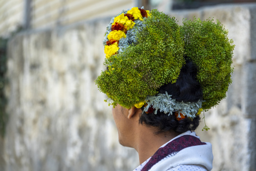 Portrait of a flower man wearing floral crowns on the heads, Jizan Province, Addayer, Saudi Arabia