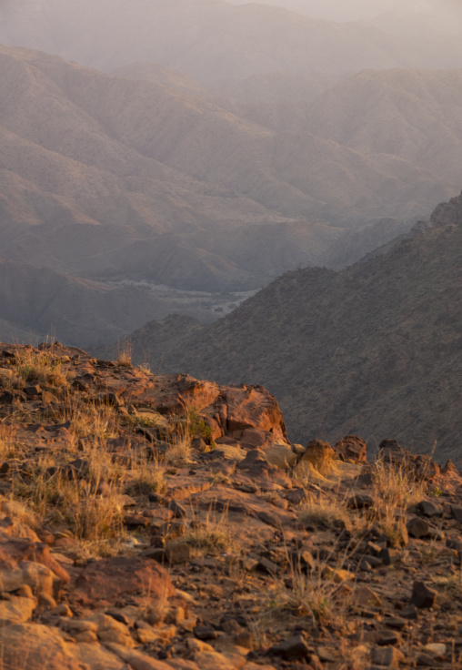 Mountain landscape shrouded in mist at dusk, Jizan Province, Add