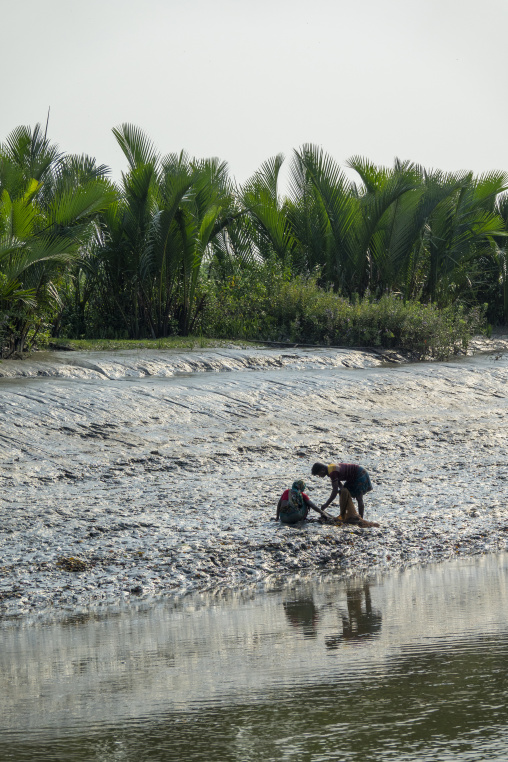 Bangladeshi people fishing shrimps in the river, Khulna Division, Mongla, Bangladesh
