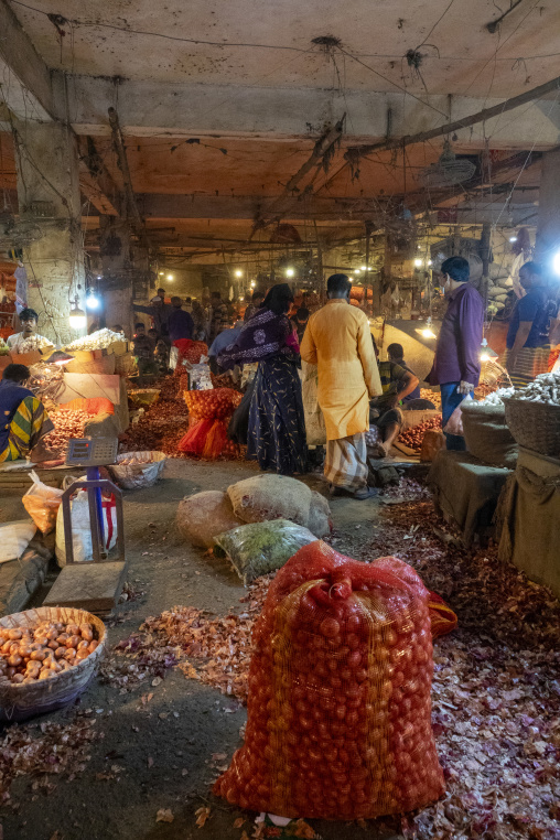 Workers and buyers at an onion wholesale market, Dhaka Division,