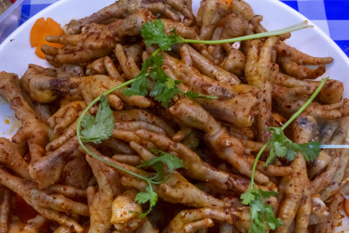 Chicken feet dish is served with cilantro garnish, Gansu Province, Linxia, China