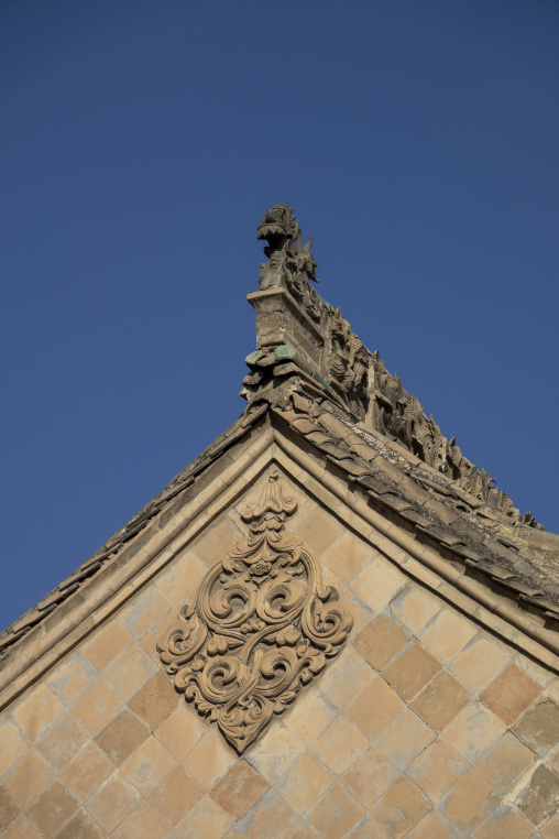 Dragon finial tops a rooftop gable at Dong Gong Guan mansion, Gansu Province, Linxia, China