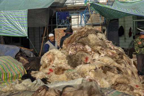 Hui Muslim traders gather at a yak leather and wool market, Gansu Province, Linxia, China