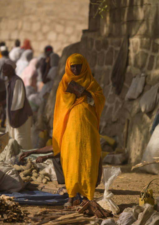 Eritrean woman dressed in yellow in the monday market, Anseba, Keren, Eritrea