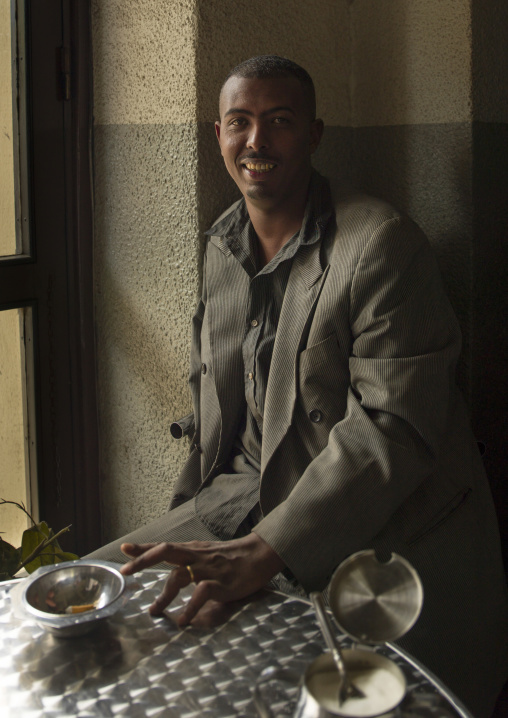 Former army fighter with hand handicap in a bar, Central Region, Asmara, Eritrea