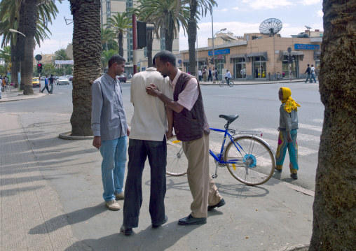 Former fighters handshake in the street, Central Region, Asmara, Eritrea