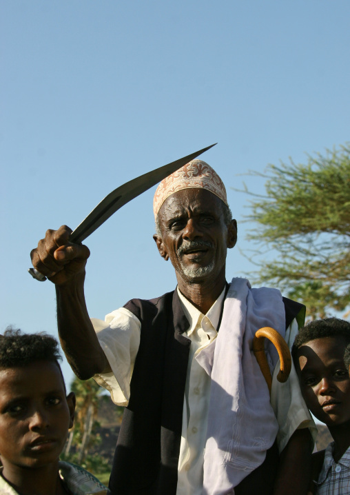 Afar man with traditional knife during a wedding, Northern Red Sea, Thio, Eritrea